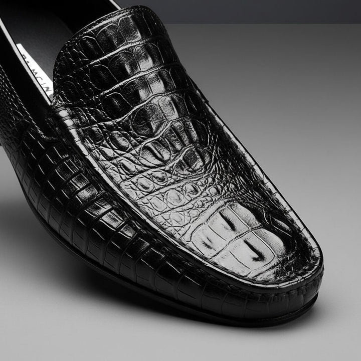 Unique crocodile embossed men's slip-on loafers. Elegant formal and casual footwear, offering comfort and style.