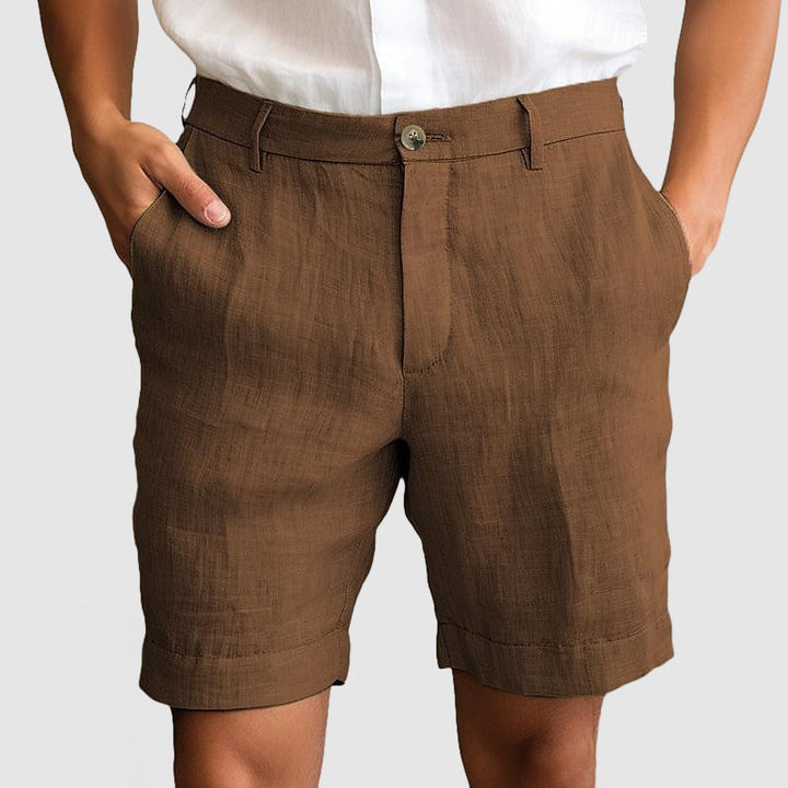 Comfortable men's chino shorts, cuffed and flat front, offering a tailored fit for summer.