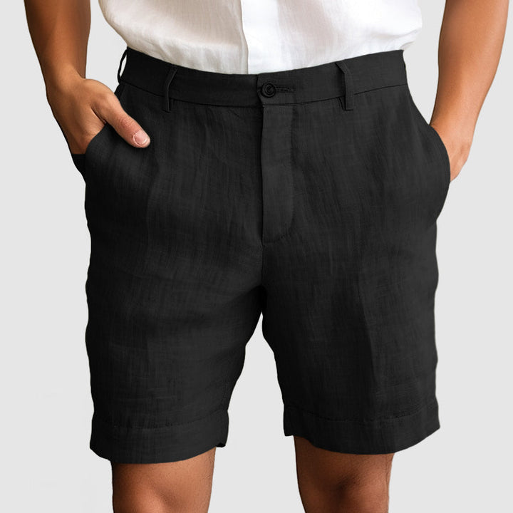 Men's comfortable flat front cuffed dress shorts, versatile for any casual or smart summer outfit.