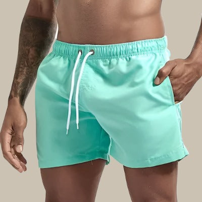Soft, comfortable men's swim shorts with drawstring, great for all-day summer wear at the beach.