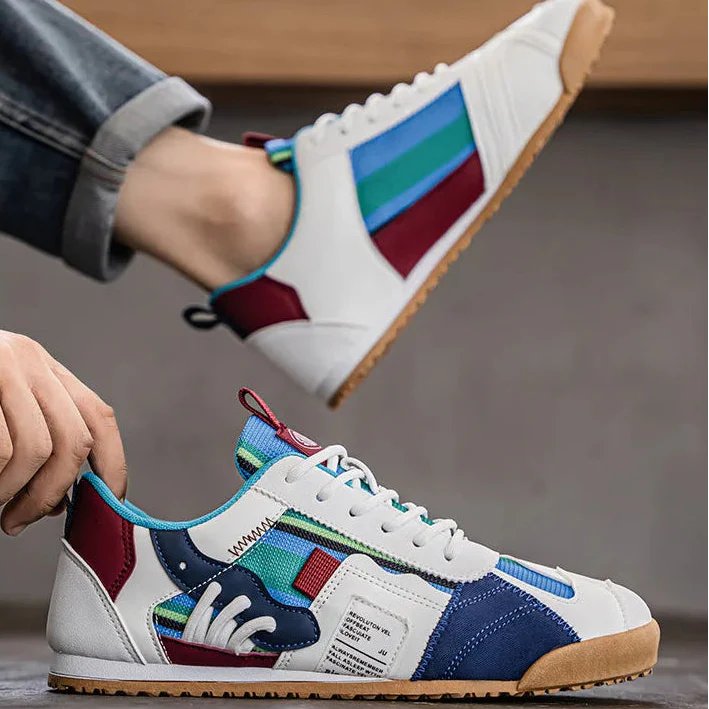 Man walking in durable patchwork utility sneakers on a city street. Everyday wear.