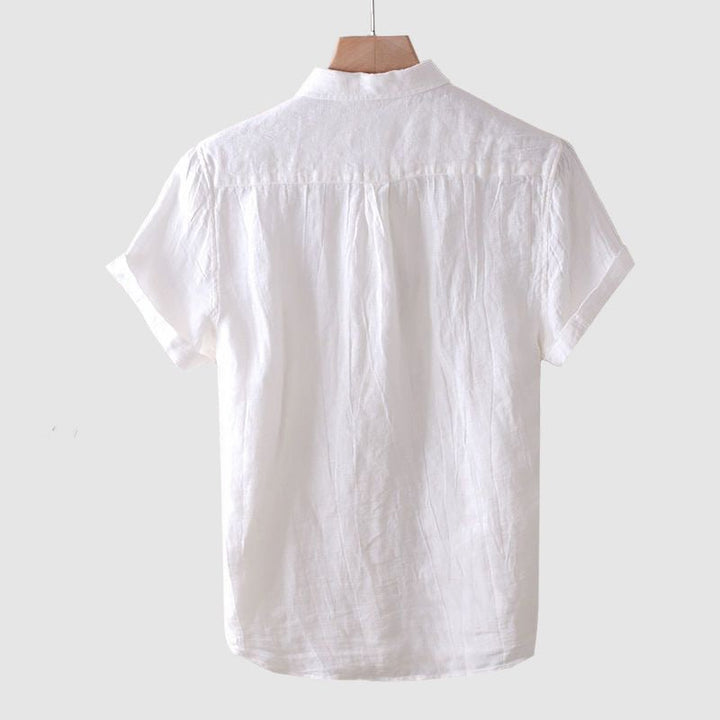 Comfortable men's short sleeve casual shirt, ideal for warm weather. Relaxed fit top perfect for summer versatility.