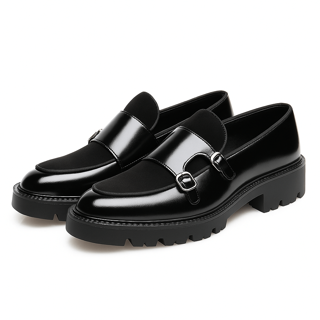 Black men's monk strap loafers with dual buckles, versatile for dressy or smart casual outfits.