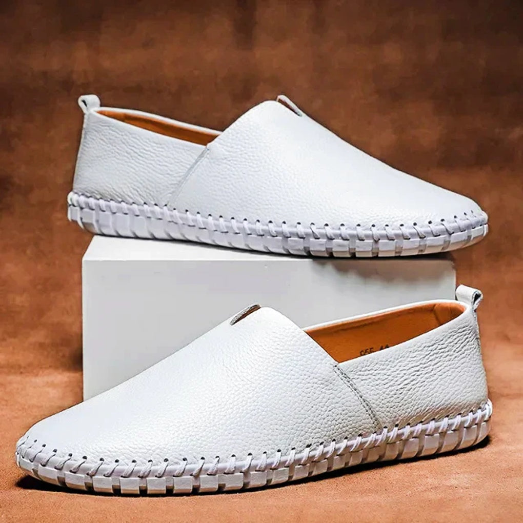 Black men's matte slip-on loafers, elegant & comfortable for formal occasions or office wear.