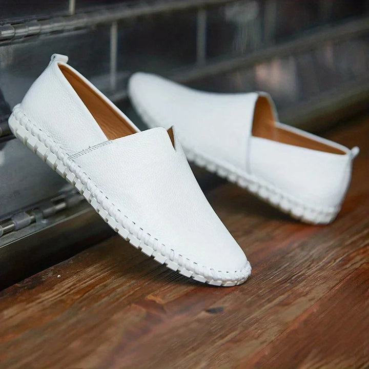 Elegant men's black matte slip-on loafers, comfortable & versatile for dress or casual wear.