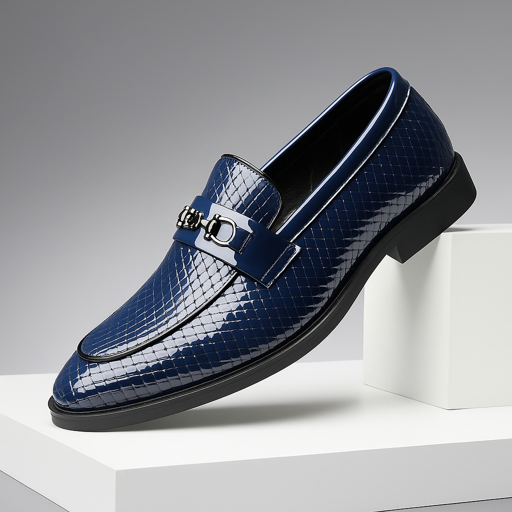 Close-up of men's embossed leather bit loafers, showing intricate texture and metal bit detail.