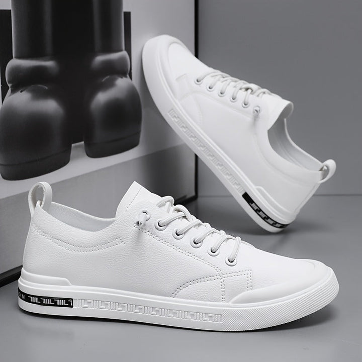 Side view of men's comfortable casual sneakers, ideal for walking & everyday style. Features a minimalist, athletic design.