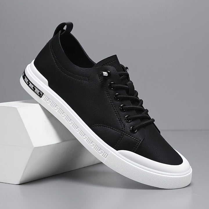 Men's versatile casual sneakers on feet, demonstrating everyday style & comfort. Classic lace-up athletic shoes for urban fashion.