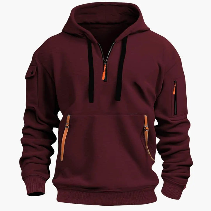 Classic men's pullover hoodie for everyday comfort, equipped with an adjustable hood and zipped pockets.