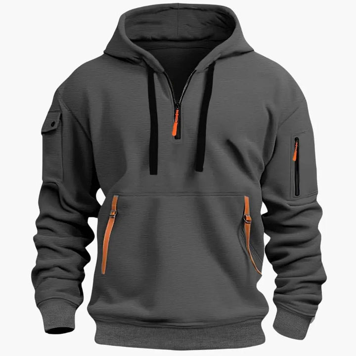 Stylish men's streetwear hoodie with a half-zip design, adjustable hood, and practical secure zipped pockets.