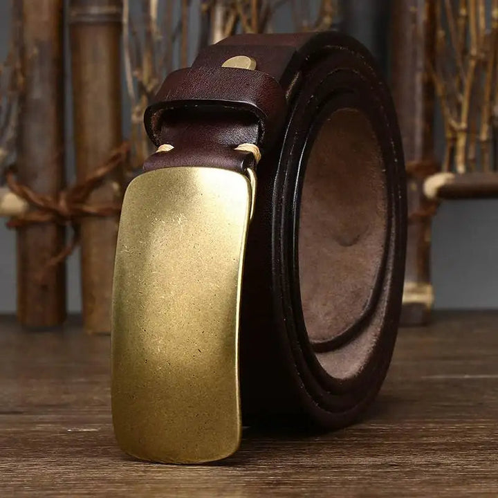 Vintage-look men's cowhide leather belt featuring a solid forged brass buckle. Casual fashion accessory.