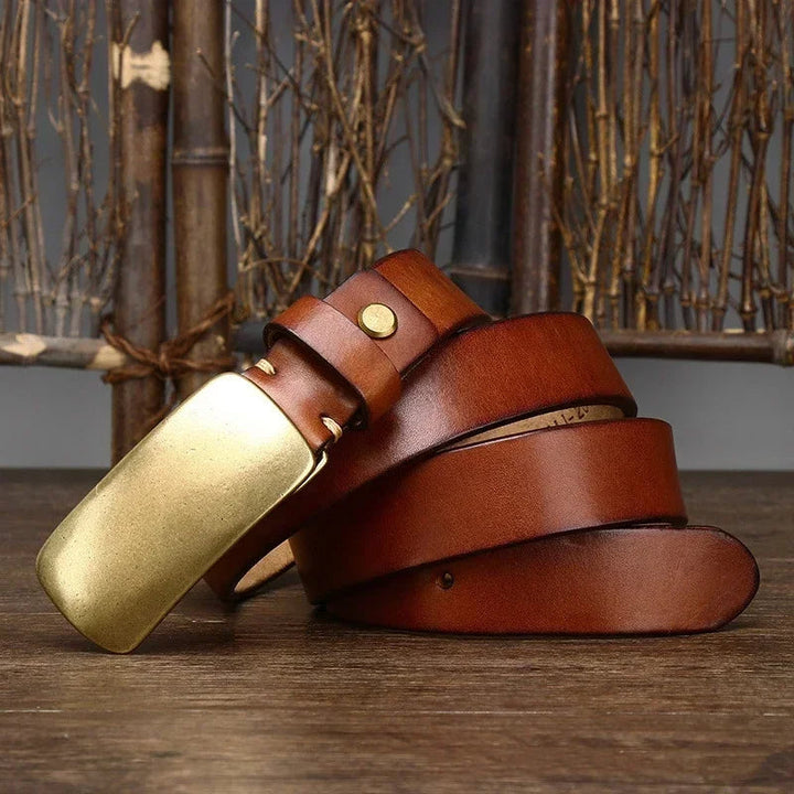 Full-grain cowhide leather belt for men with a distinctive forged brass buckle. Timeless casual accessory.