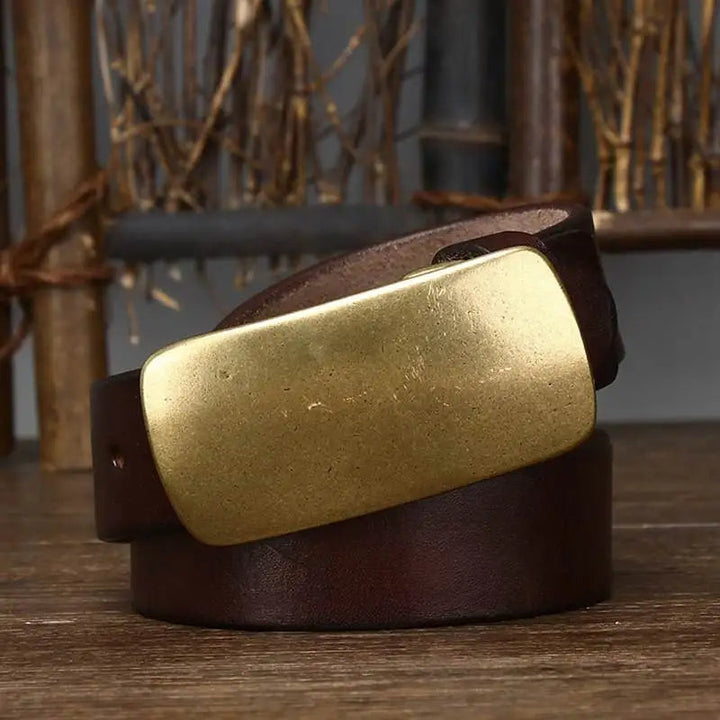 Premium men's leather belt with a unique forged brass buckle. Durable and stylish for rugged fashion.