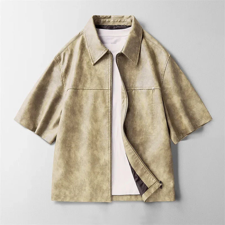 A versatile men's short-sleeve genuine leather shirt in beige, ideal for various casual occasions.