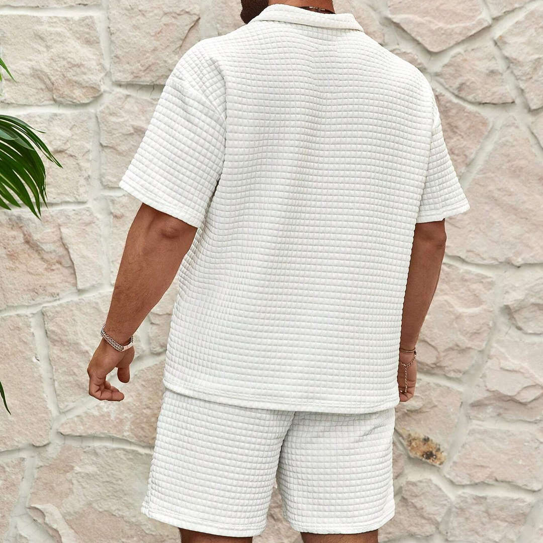 Stylish men's half-zip polo and matching shorts summer set. Effortless, comfortable casual outfit for warm days.