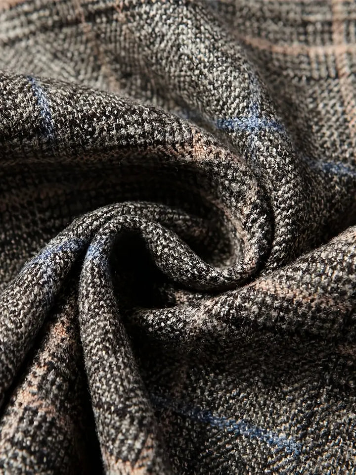 Stylish men's checked blazer jacket with a tailored fit, showcasing heritage fashion and business elegance.