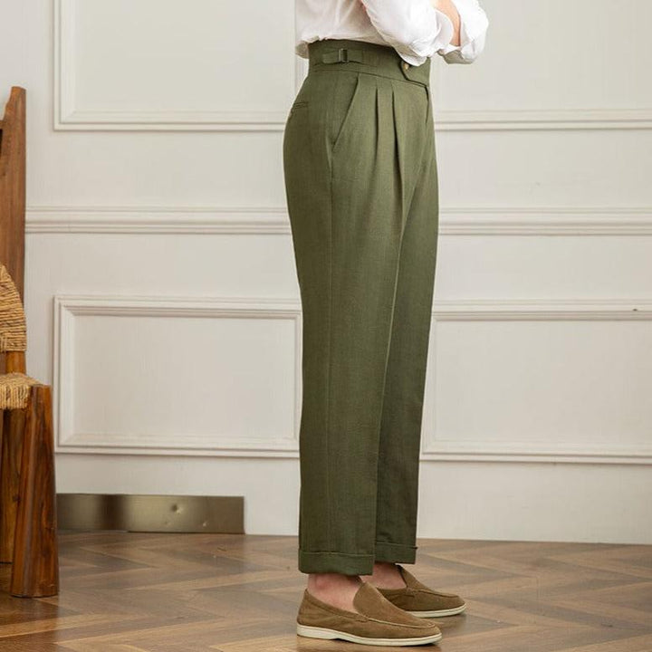 Elegant men's high-waisted pleated formal trousers, embodying classic Italian smart casual fashion.