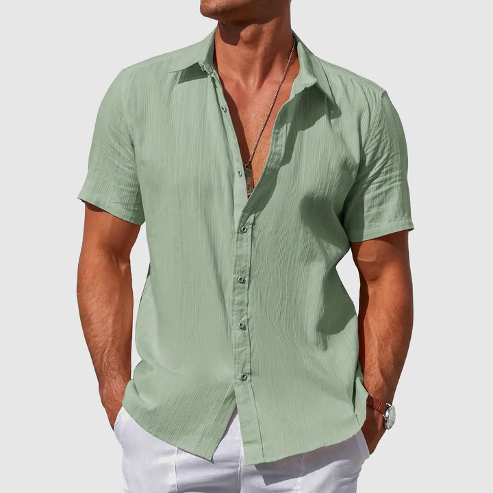 Comfortable men's relaxed fit textured short sleeve button shirt, perfect for summer casual.