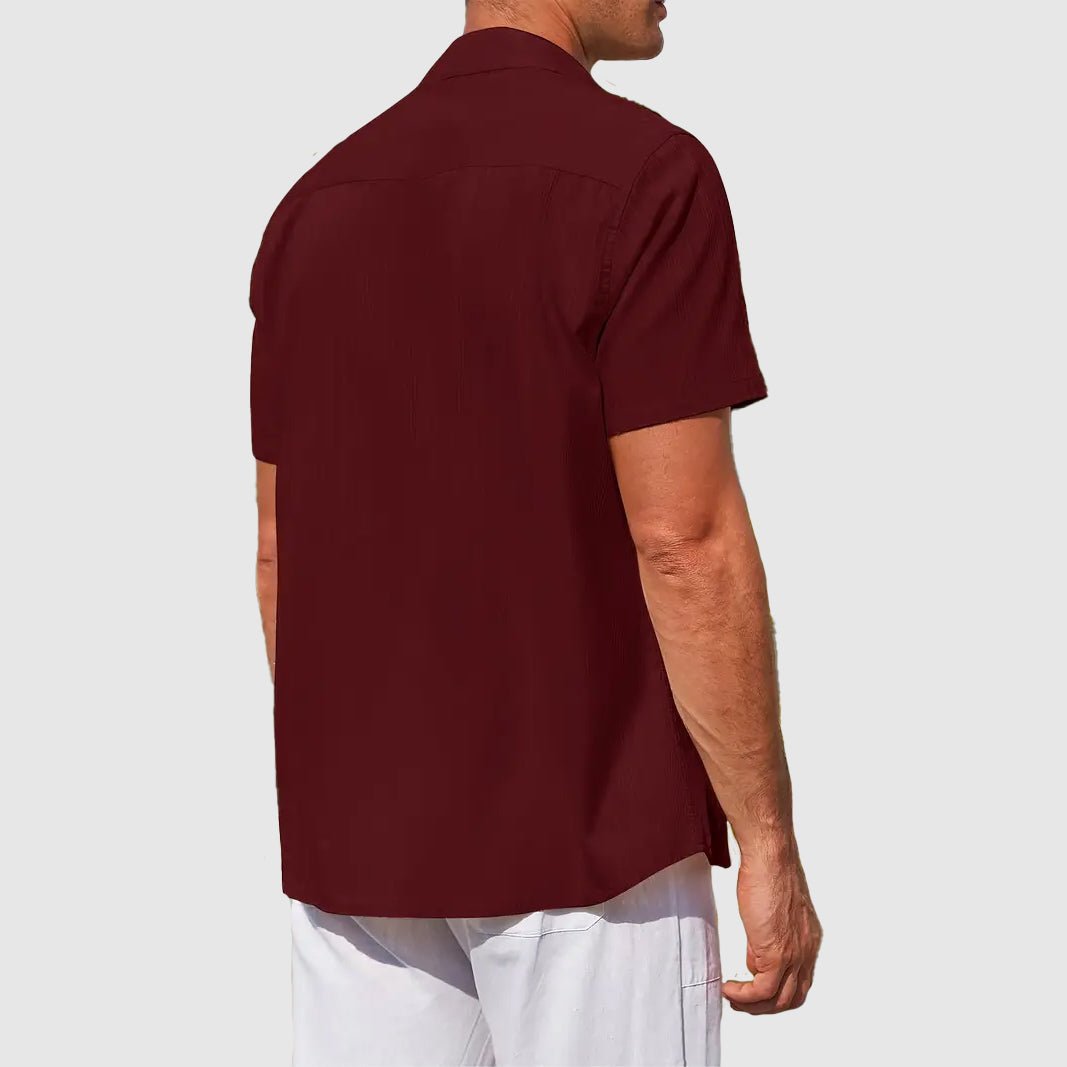 Light blue men's textured short sleeve top, button-front design for a casual summer style.