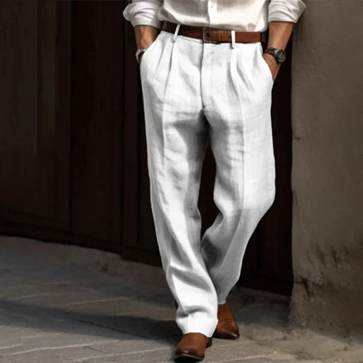 Relaxed fit double-pleated men's summer pants in beige, ideal for elegant and smart casual warm weather outfits.