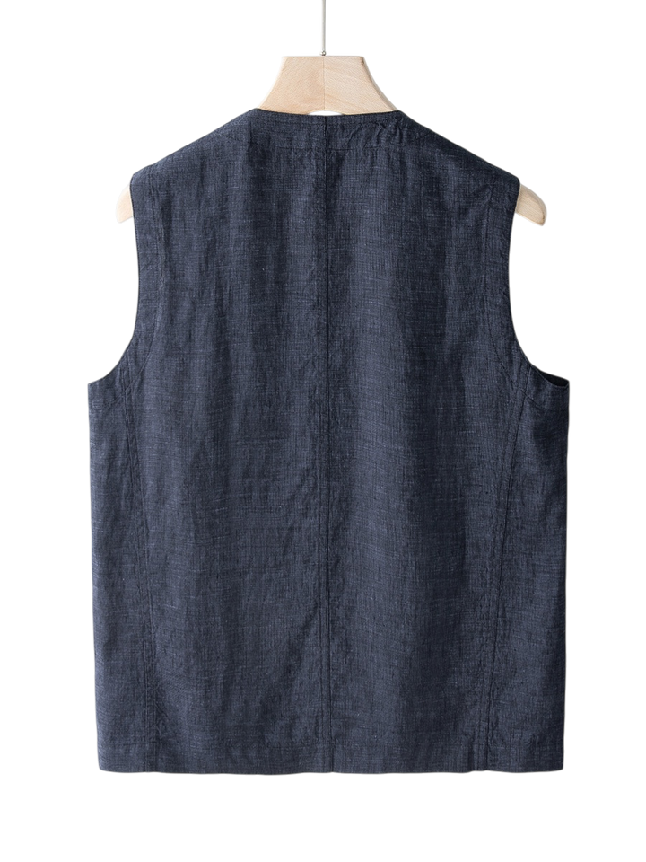 Versatile men's linen vest, a lightweight sleeveless layer for summer casualwear or dressed-up smart casual looks.