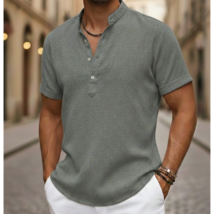 Man wearing a relaxed fit short sleeve linen blend henley shirt, showcasing comfortable summer casual fashion.