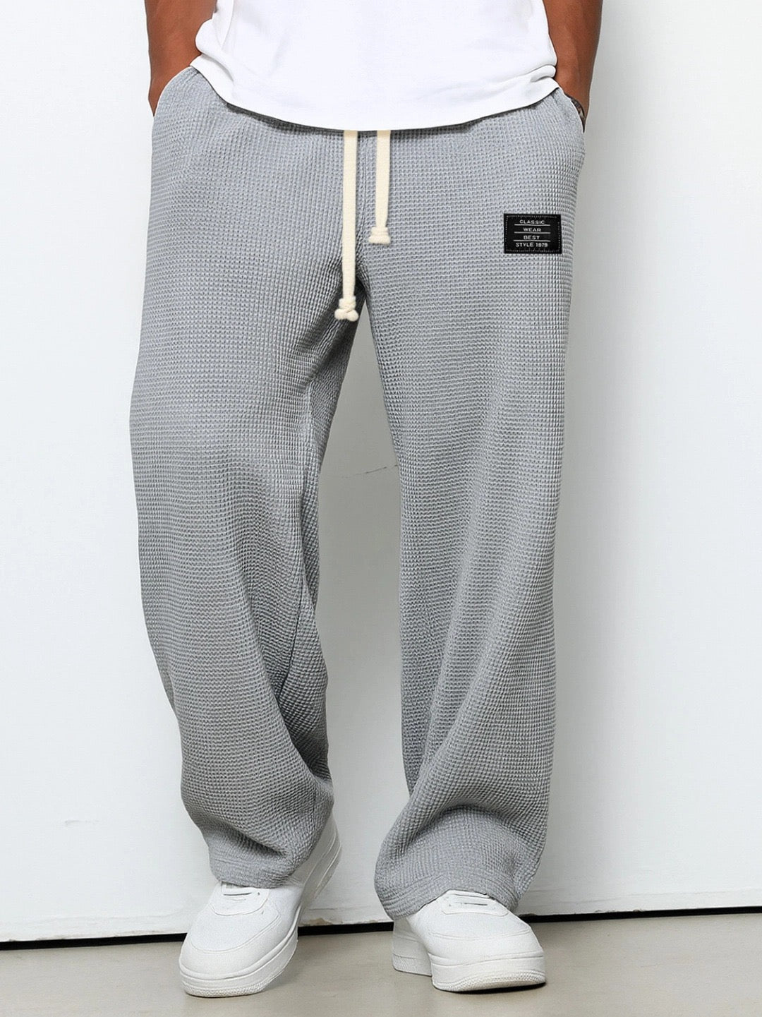 Relaxed fit men's comfort pants with drawstring, perfect for lounging or casual outings.