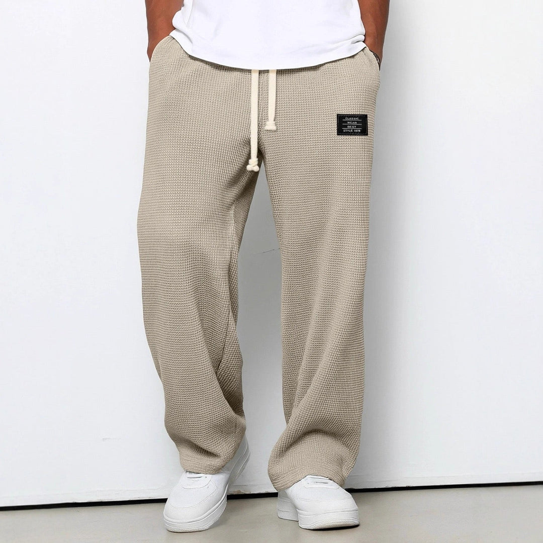 Men's wide leg drawstring pants, loose fit, offering ultimate comfort and casual style.