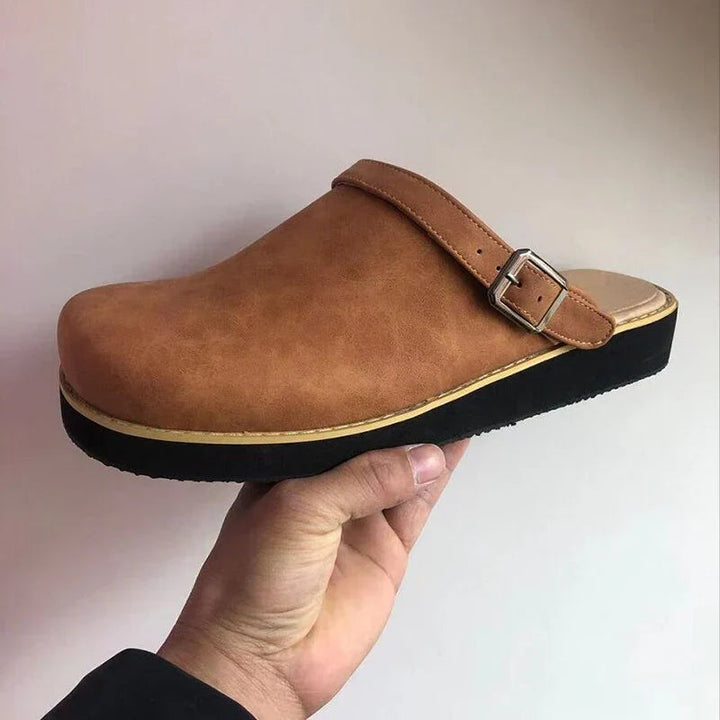 Side view of men's casual slip-on leather clogs, perfect for everyday comfort and style.