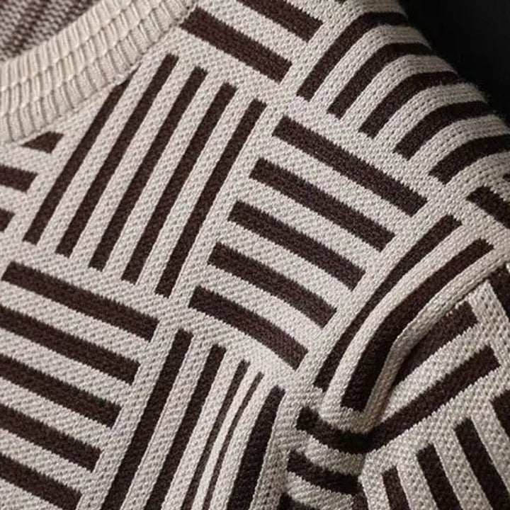 Elevated men's knit top with soft fabric, geometric design, and ribbed trim for versatile fashion.