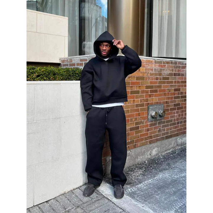 Front view of a men's minimalist hooded sweater and jogger set, emphasizing comfort