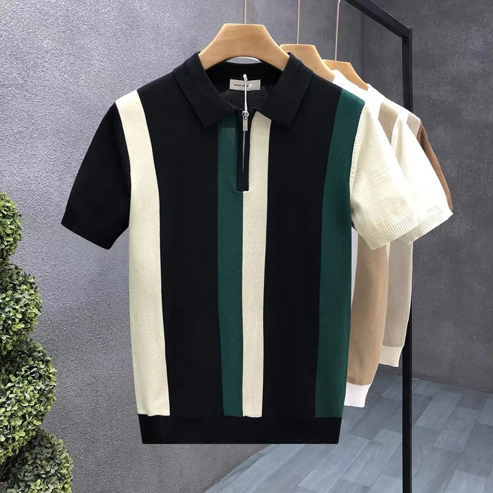 Comfortable men's zip polo shirt featuring a stylish striped and color-block design for a modern look.
