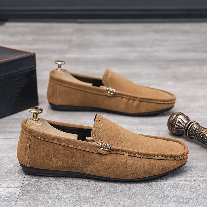 Pair of black men's comfort loafers, suitable as orthopedic footwear for everyday casual dress.