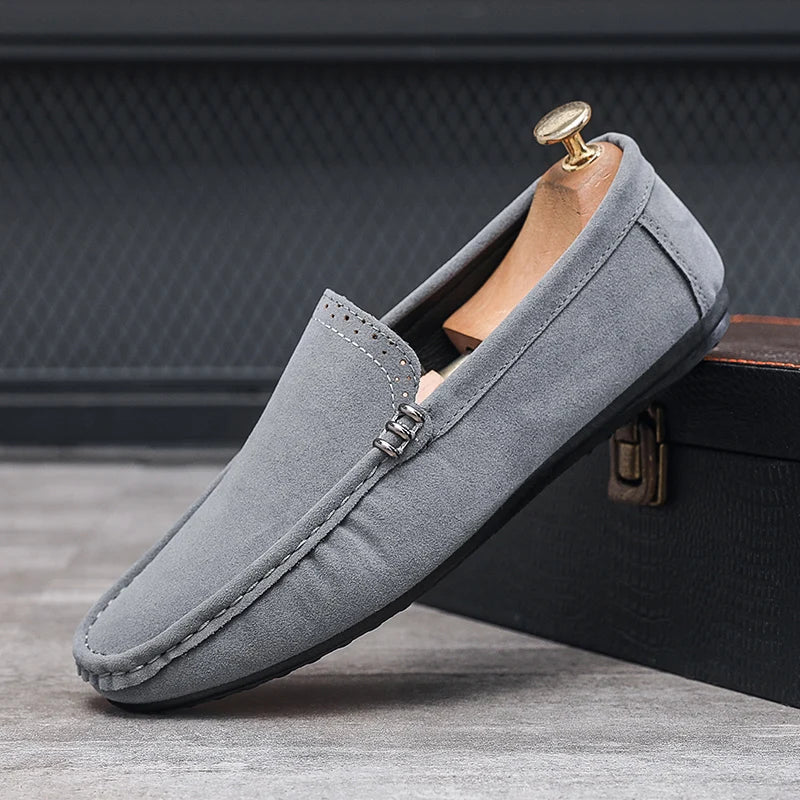 Side view of a men's orthopedic loafer, showcasing its supportive sole and classic design.