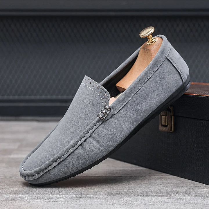 Side view of a men's orthopedic loafer, showcasing its supportive sole and classic design.