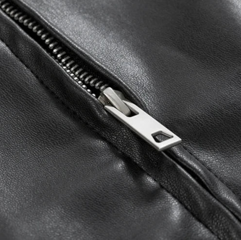 Side profile of a men's black faux leather bomber jacket, showcasing its relaxed, oversized fit