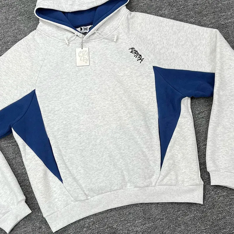 Men's oversized hoodie with sporty contrast panels. Comfortable hooded sweatshirt, ideal for casual street style.