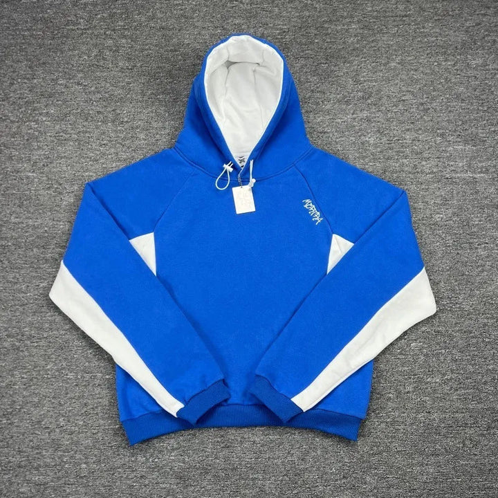 Stylish men's oversized hoodie with sporty contrast panels. A comfortable, versatile top for urban fashion.