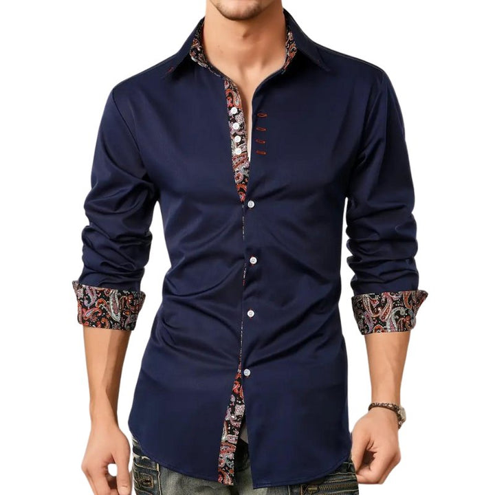 Fashionable man in a paisley slim fit long sleeve button-down shirt, showcasing distinctive elegance.