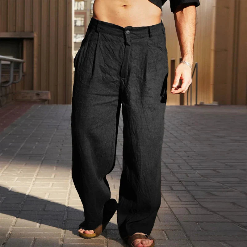 Full view of men's loose fit wide leg chino pants, highlighting the comfortable design and pleated casual style.