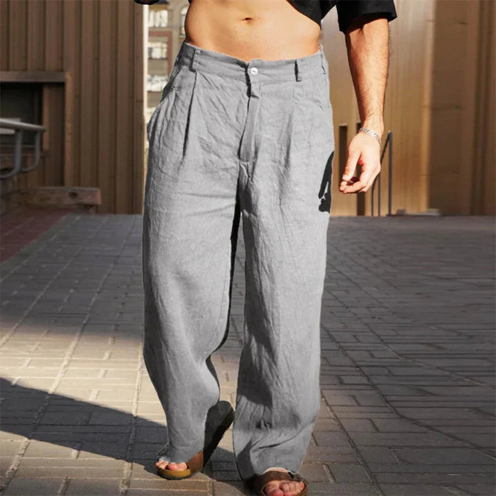 Comfortable men's wide leg pleated chino pants, offering a modern loose fit ideal for relaxed casual fashion.