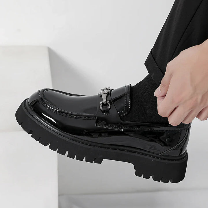 Men's formal footwear: sleek, polished black loafers, ensuring a sharp and sophisticated professional style.