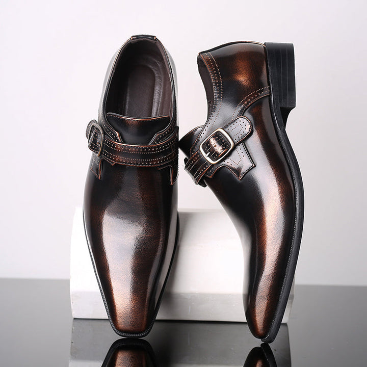 Men's polished black single buckle monk strap dress shoes, perfect for formal business attire.