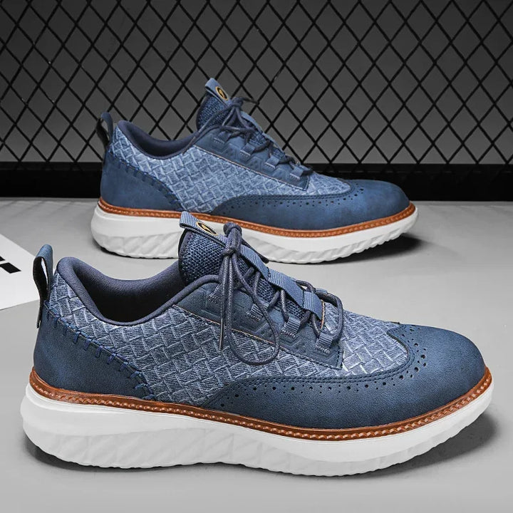 Athletic men's leather sneakers in a blue shade, offering breathable and comfortable casual wear.