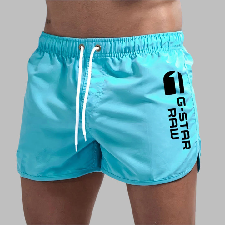 Men's quick-dry athletic swim trunks for beach & pool. Ideal swimwear for summer water sports.