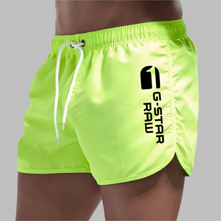 Fast-drying men's swim trunks, versatile pool shorts & beachwear. Great for water sports & casual summer fashion.