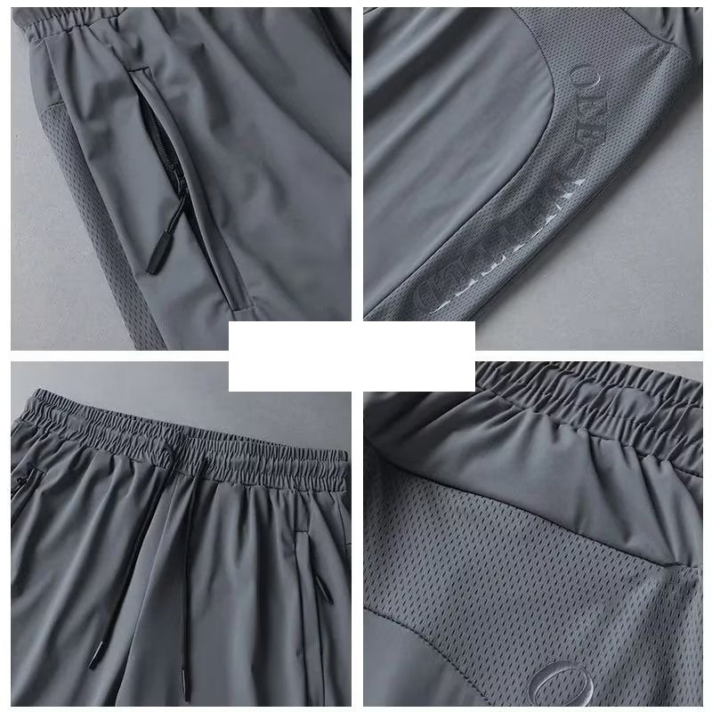 Men's athletic shorts featuring an elastic waistband and drawstring for a secure, comfortable fit.