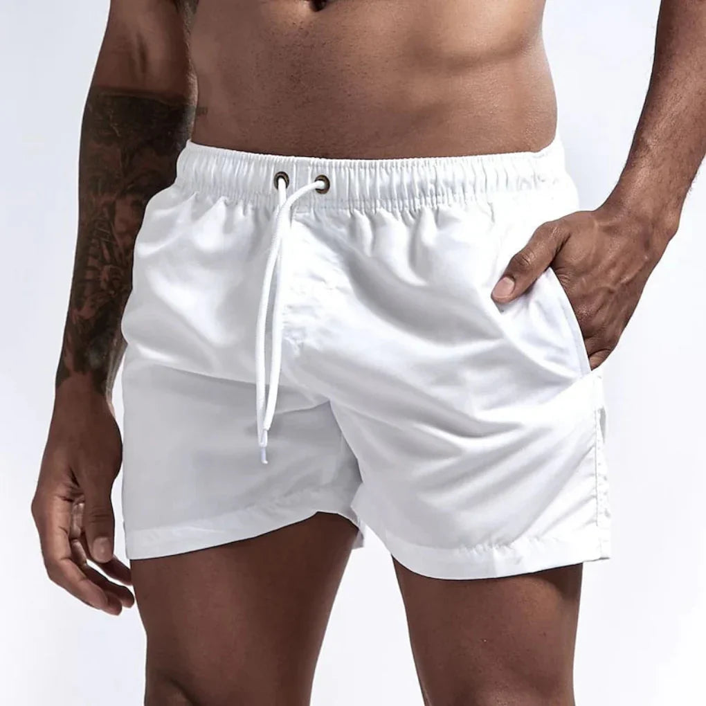 Comfortable men's board shorts, quick-drying fabric, ideal for swimming & active beachwear.