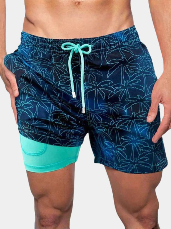 Men's quick-dry swim shorts with supportive compression liner, ideal for beach or pool activewear.