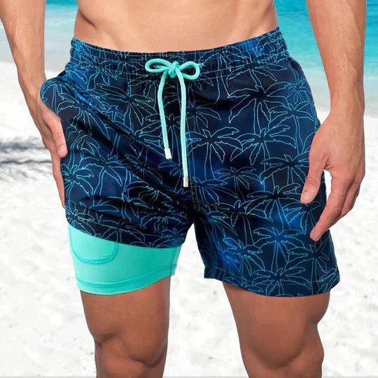 Stylish men's tropical print quick-dry swim shorts with compression liner for beach and active wear.